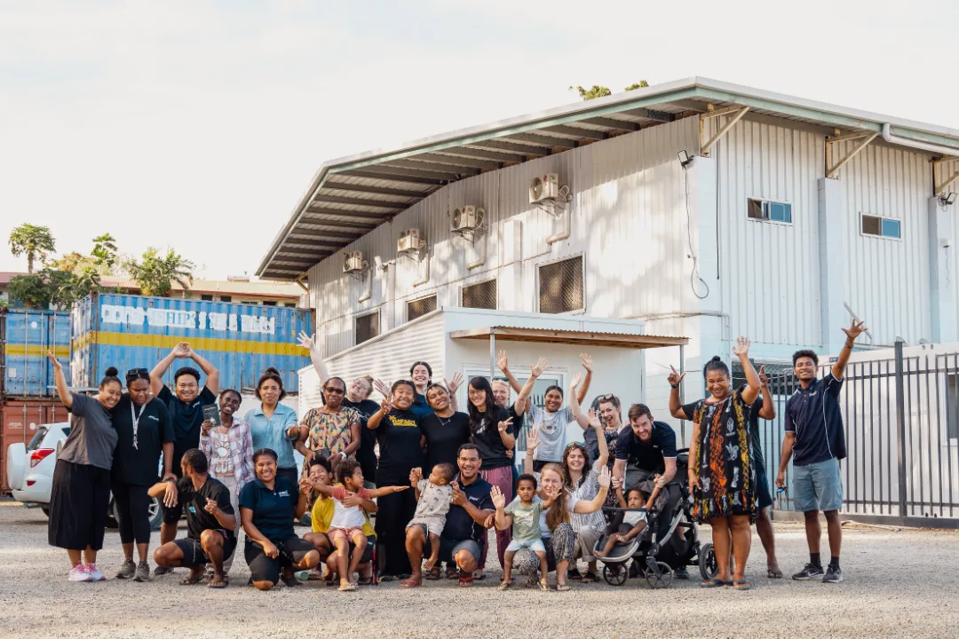 Staff and families outside the Port Moresby campus