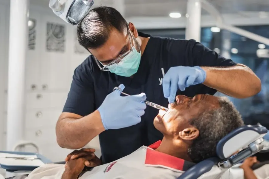 Dental team treating a patient in a rural community