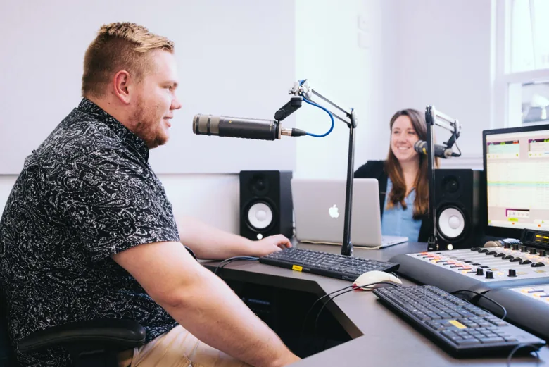 Fresh FM presenters recording in the radio studio