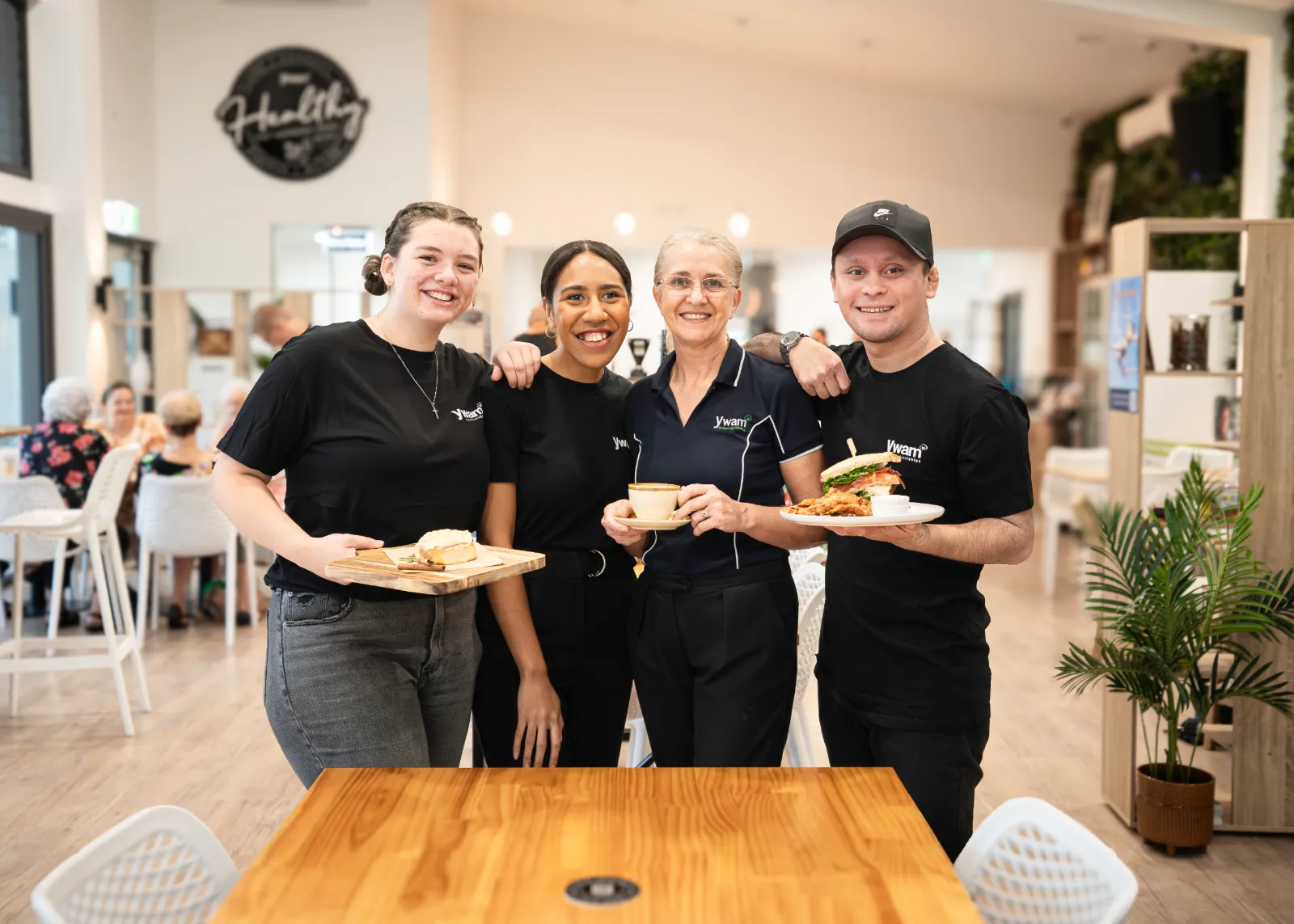 YWAM Precinct Cafe team with coffee and food