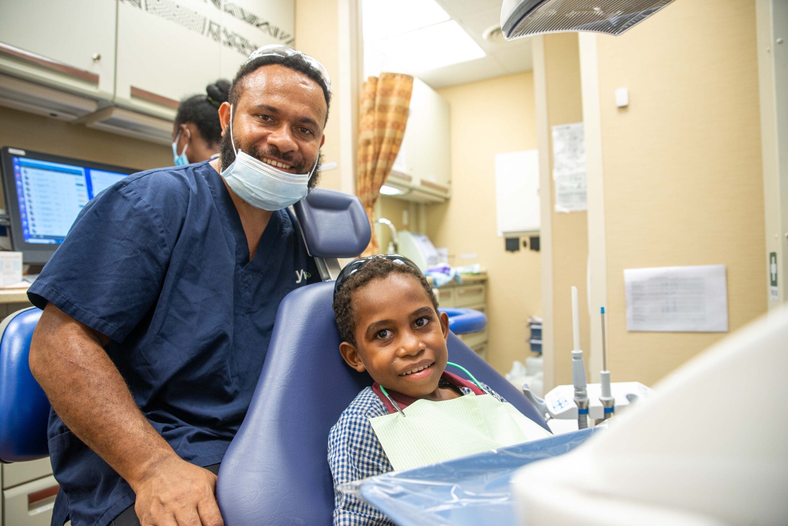 Dental Therapist Resident, John Timothy with student